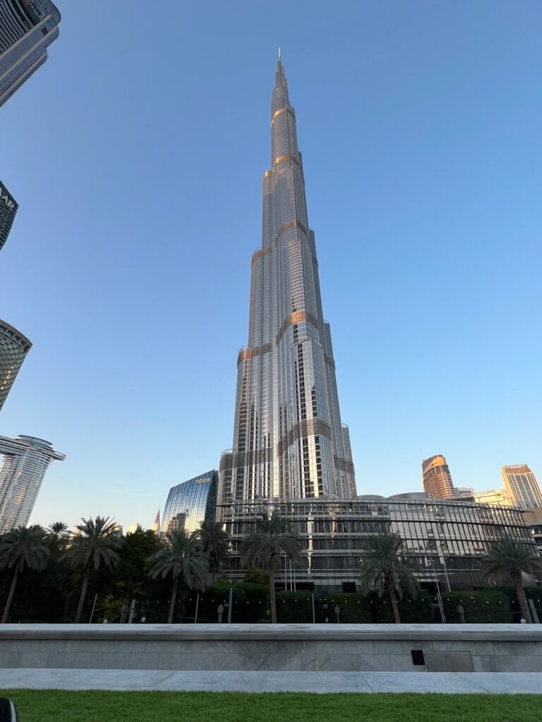 a very tall building towering over a city